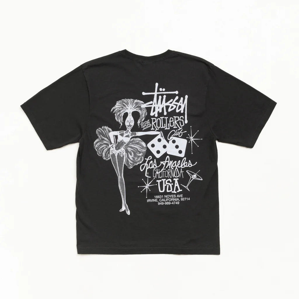 A black short-sleeve t-shirt with a white graphic print on the back, featuring a stylized dancer, dice, and the text 'Stussy ROLLERS' and 'Los Angeles, California USA'.