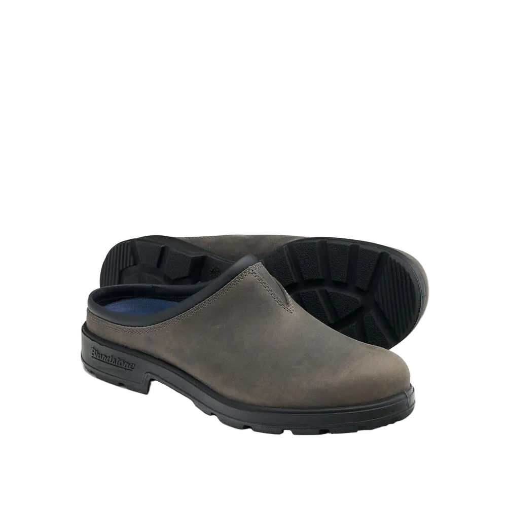 Pair of brown clogs with black soles on a white background