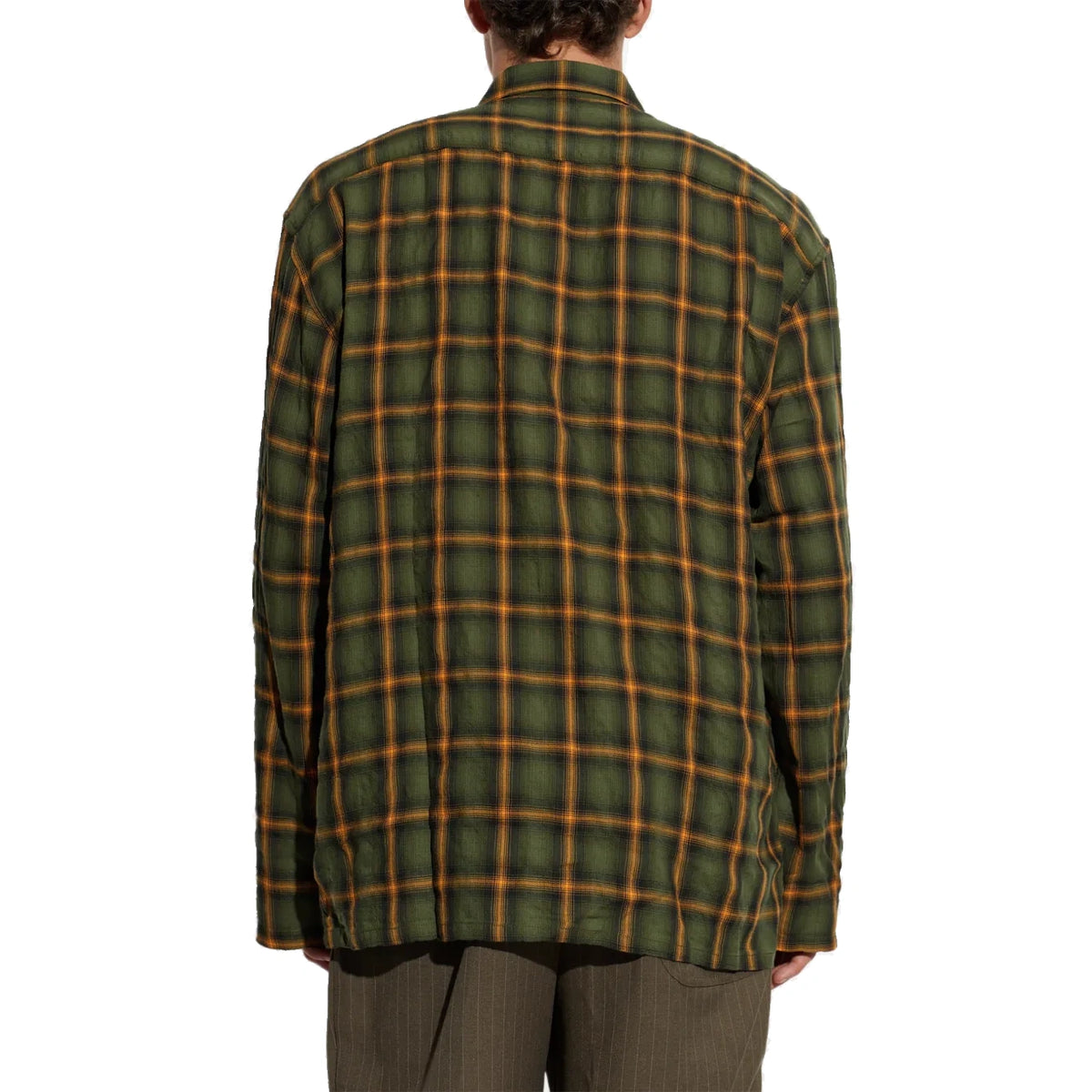 Back view of the School Shirt on a model, showing the oversized fit, dropped shoulders and crinkled plaid fabric.