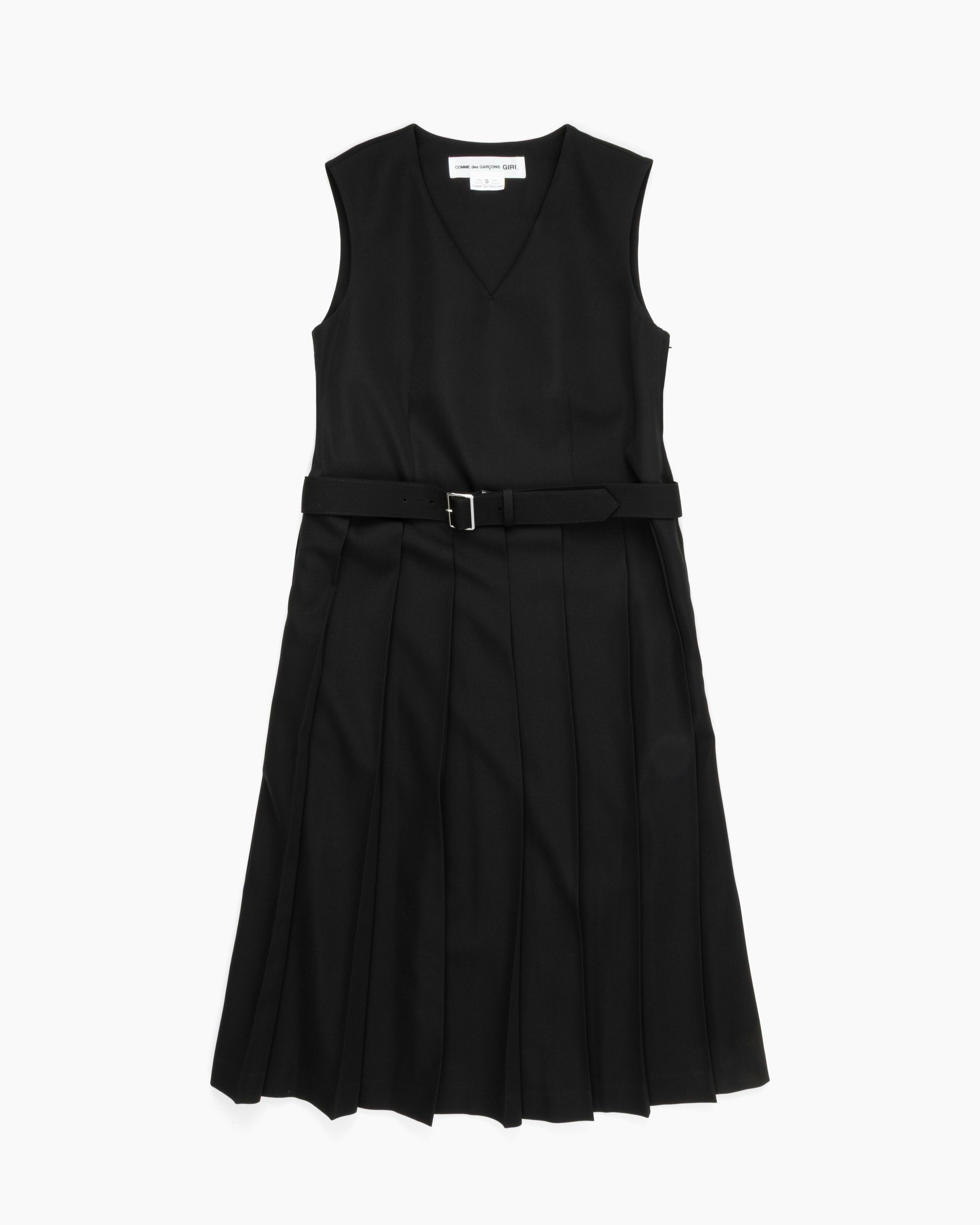 Black COMME DES GARCONS jumper dress with pleated skirt and belt, front view
