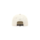 Beige cap with a black buckle on a white background