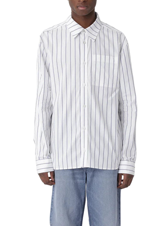 Person wearing a white shirt with black stripes and blue jeans on a white background