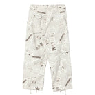 Pants with newspaper print on a white background