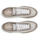 Pair of brown and beige sneakers with white laces on a white background