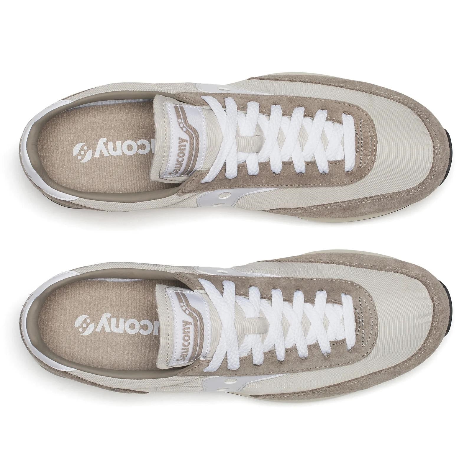 Pair of brown and beige sneakers with white laces on a white background