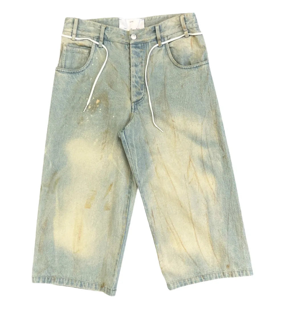 Long denim jean shorts on a white background
