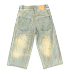 Back view of long denim jean shorts on a white background