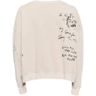 Back of a cream sweatshirt with graphic print and embroidery details on a white background
