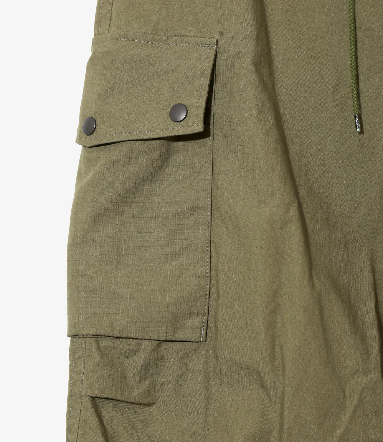 Close-up of olive green pants with a pocket and button on a white background