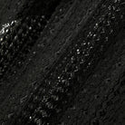 Close-up of black textured fabric with a subtle pattern
