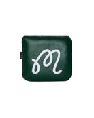 Green leather pouch with a white logo on a light gray background