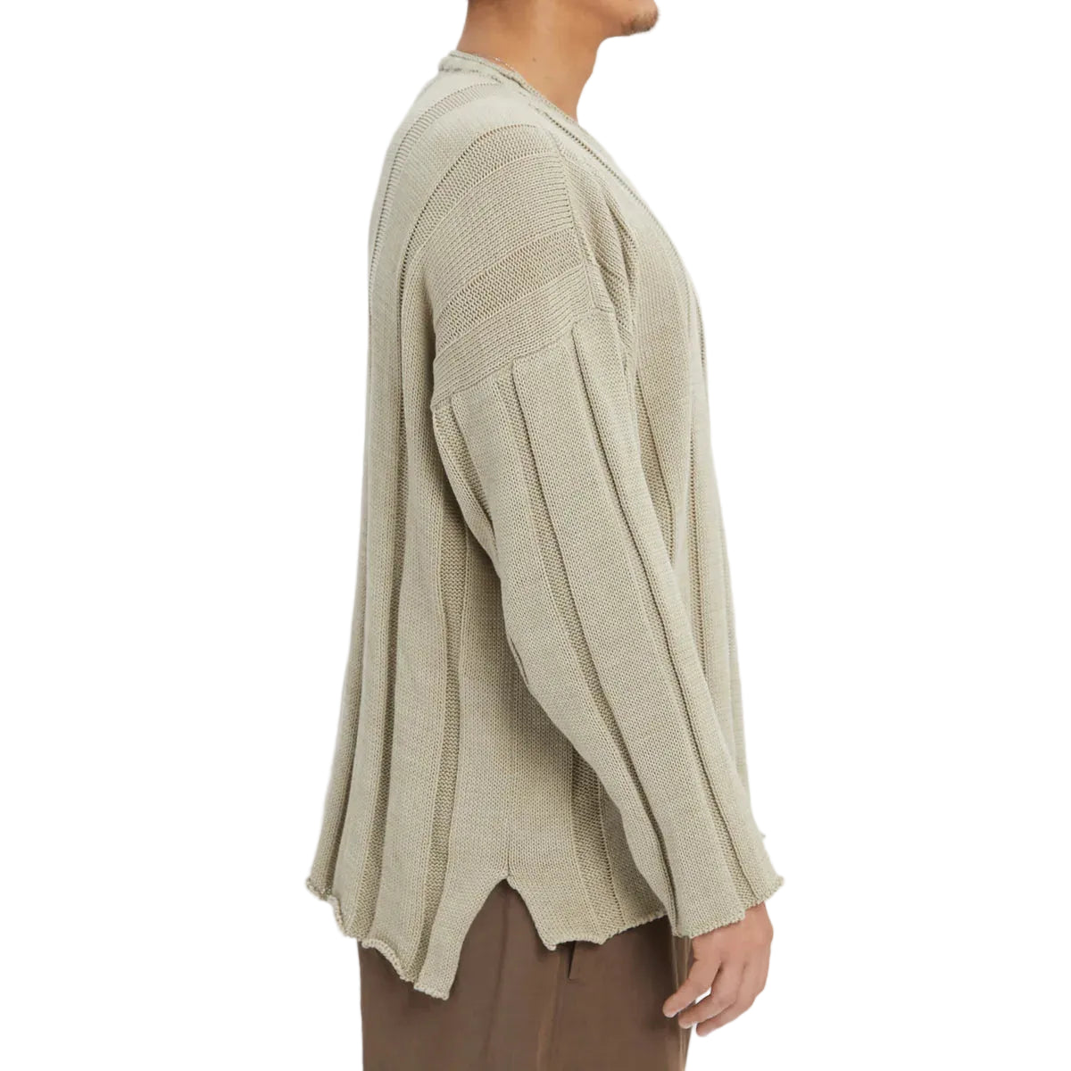 Person wearing a beige sweater on a white background