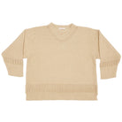 Beige sweater with textured pattern on a white background