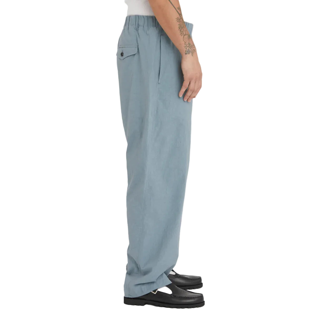 Light blue pants worn by a person on a white background