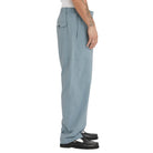 Light blue pants worn by a person on a white background