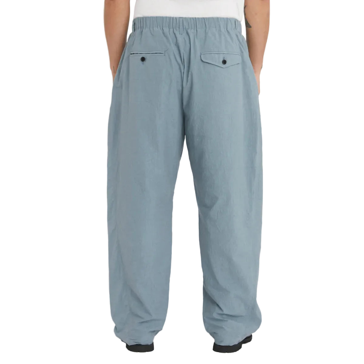 Light blue pants worn by a person on a white background