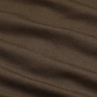 Close-up of brown fabric with visible texture and folds