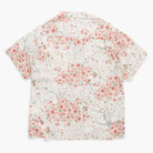 Short-sleeve shirt with floral pattern on a white background