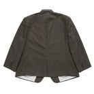 Back view of a dark gray pinstripe suit jacket on a light gray background