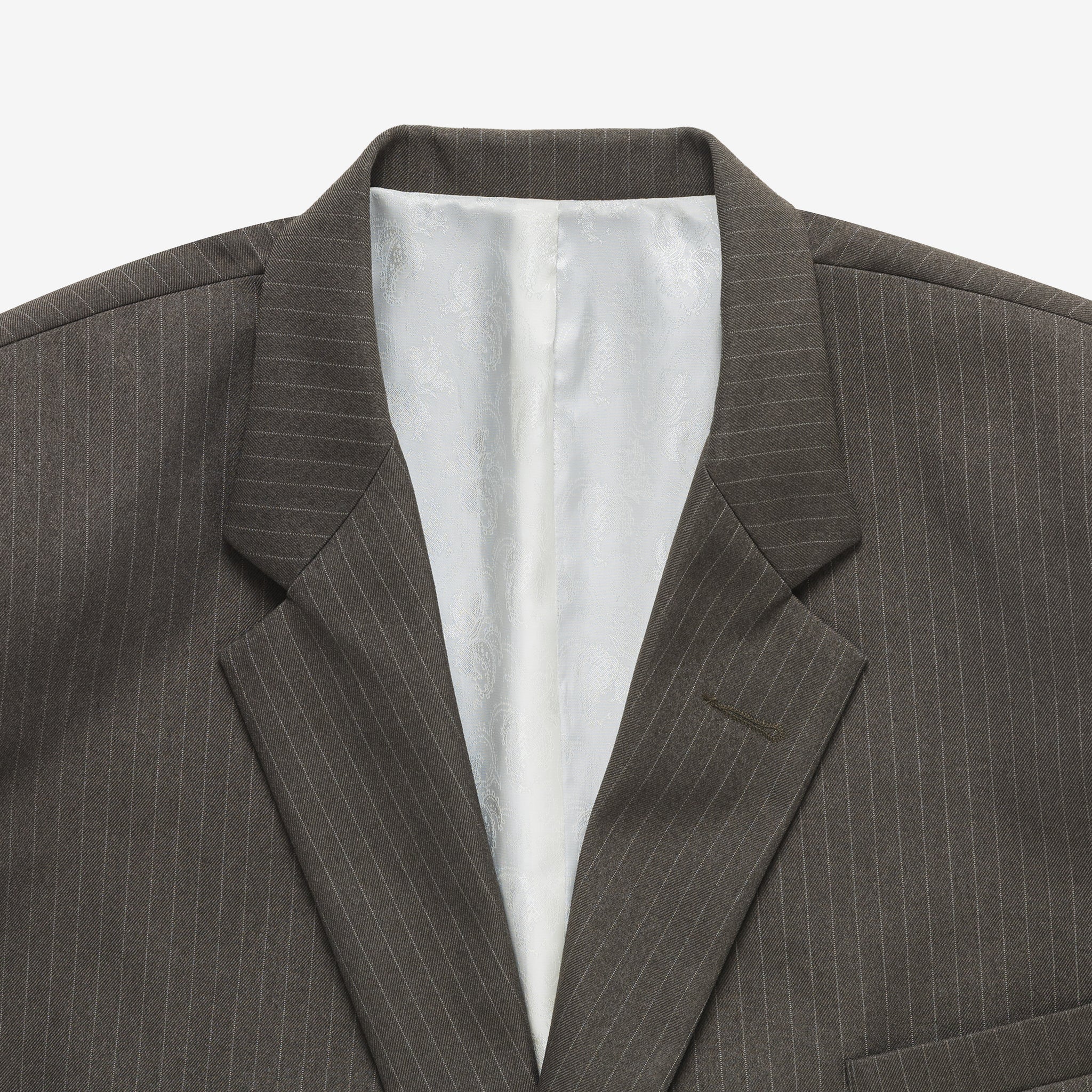 Gray pinstripe suit jacket with white lining on a light gray background