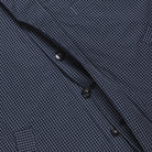 Close-up of a dark blue checkered shirt with buttons