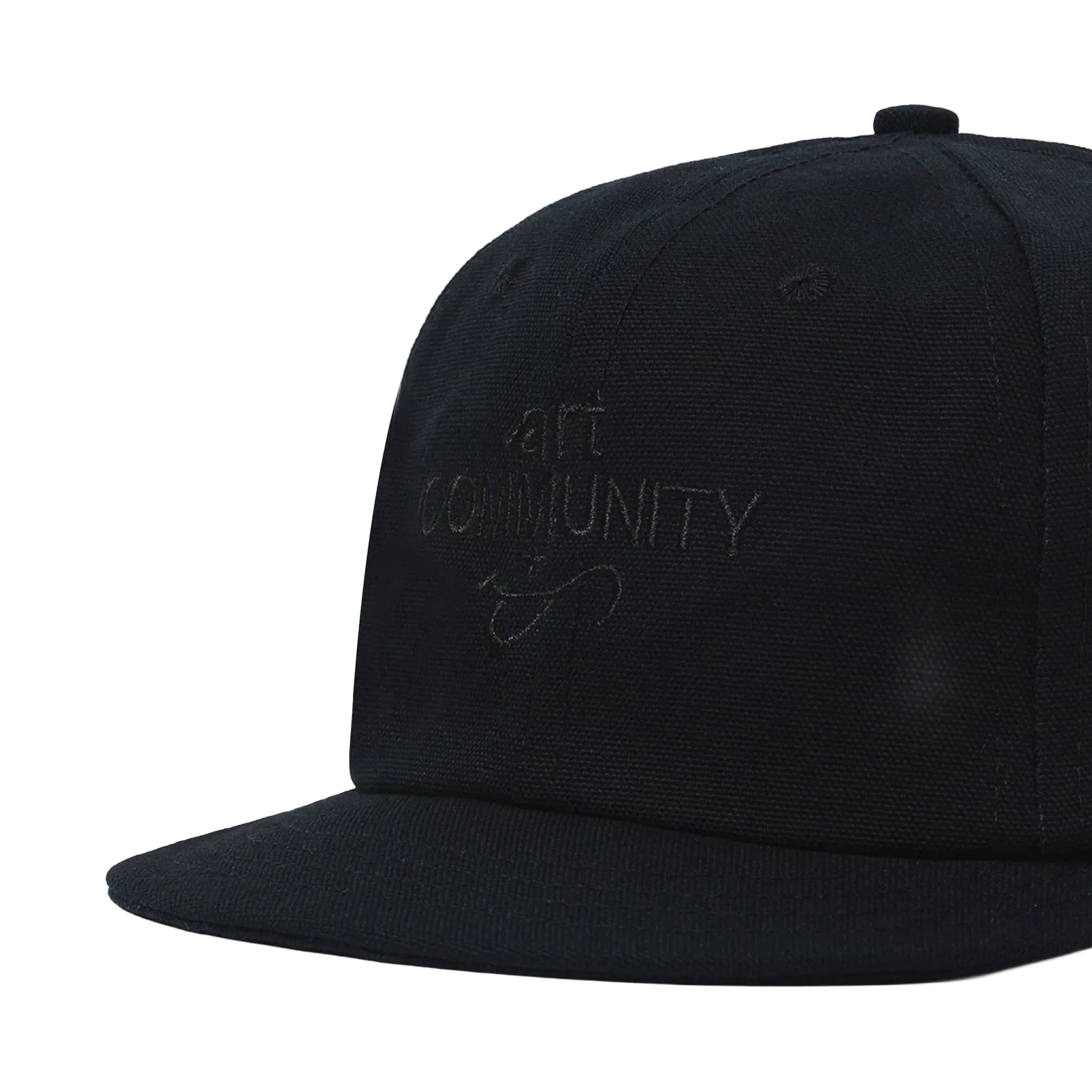 Black cap with 'art community' embroidery on a white background