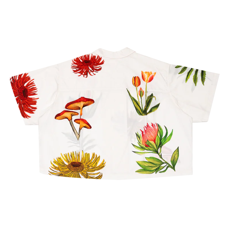 White shirt with colorful floral designs on a white background