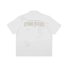 White shirt with 'Outdoor Research' logo on a white background