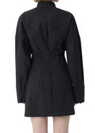 Person wearing a black dress on a white background