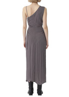 Woman wearing a gray one-shoulder dress on a white background