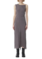 Woman wearing a gray sleeveless dress on a white background