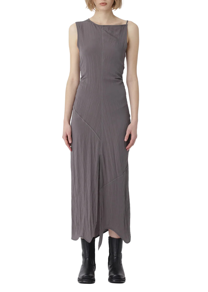 Woman wearing a gray sleeveless dress on a white background