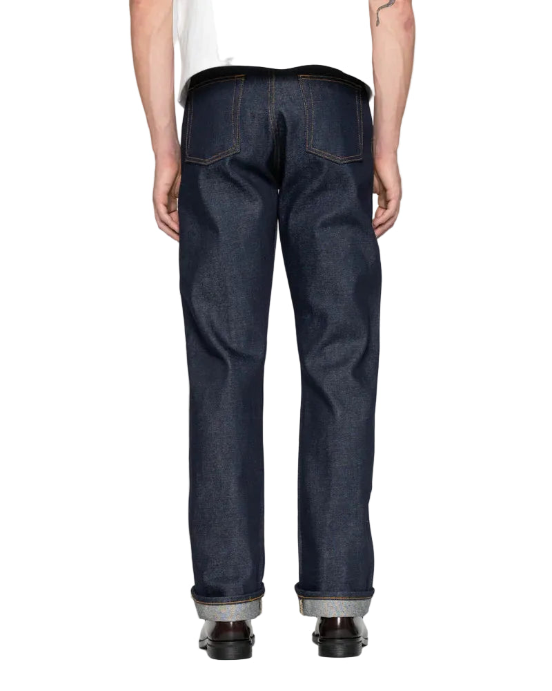 Person wearing dark blue jeans on a white background