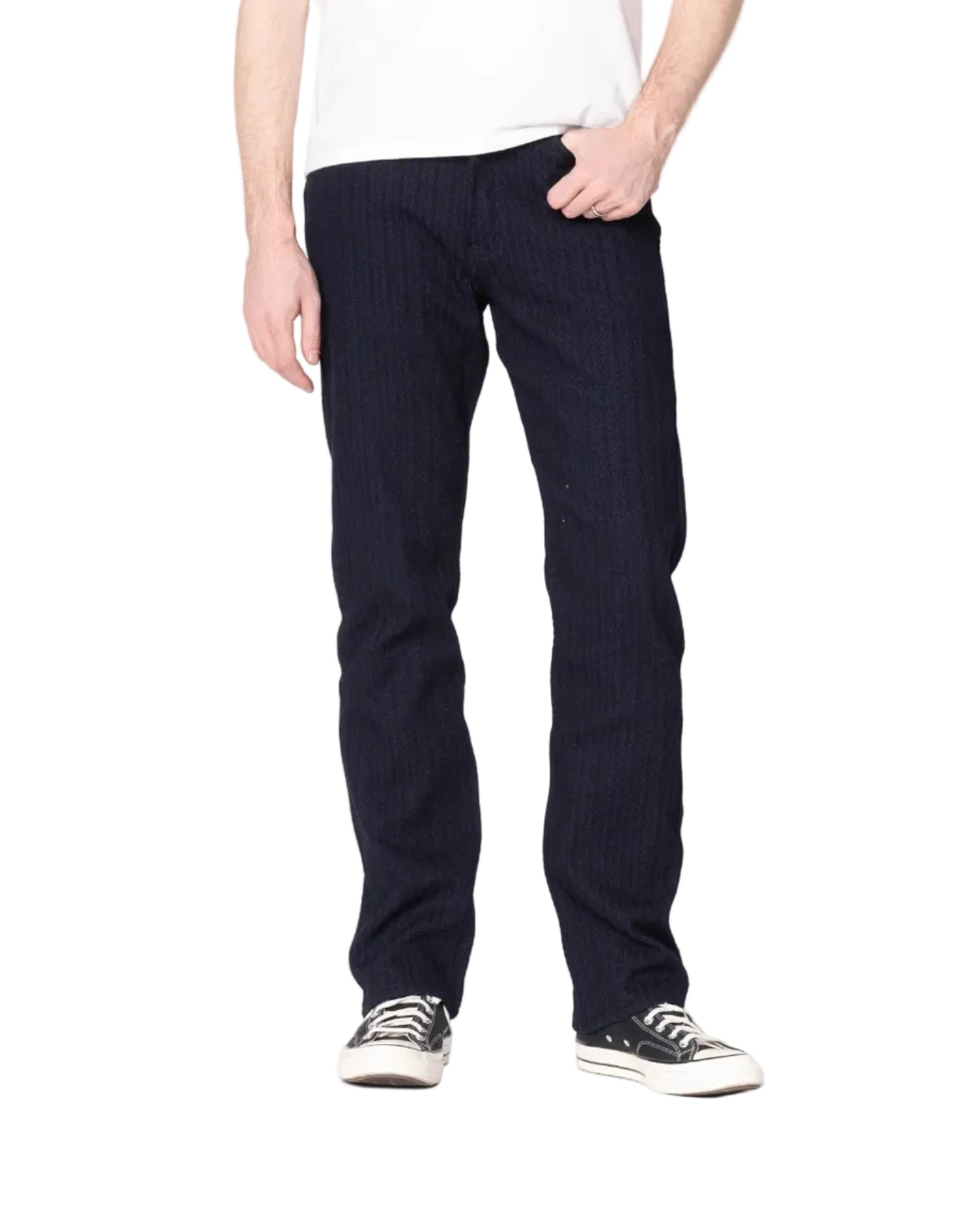 Person wearing navy pinstripe pants and black sneakers on a white background