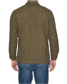 Person wearing a green jacket and blue jeans on a white background