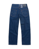 Back view of a pair of blue jeans on a white background