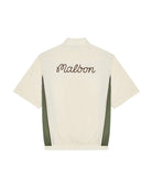 Beige shirt with 'Malbon' branding on the back against a white background