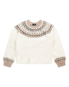 Cream-colored sweater with intricate brown patterns on a white background