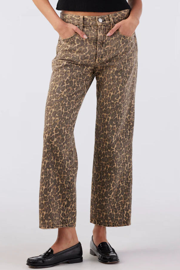 Leopard print pants worn by a person on a white background