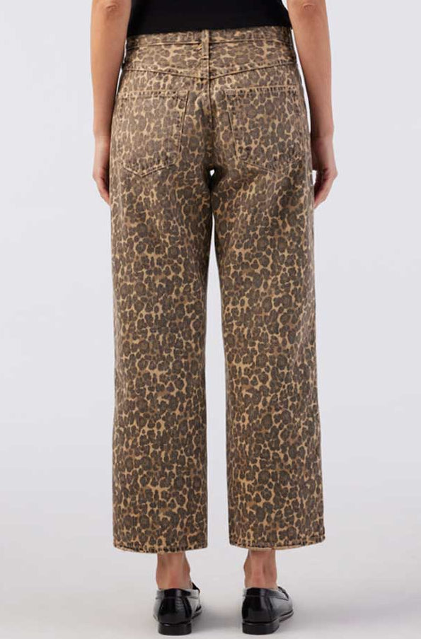 Leopard print pants worn by a person on a white background