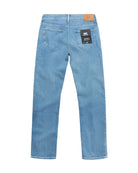 Blue jeans with a brand label on a white background