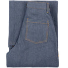 Folded blue denim jeans on a white background