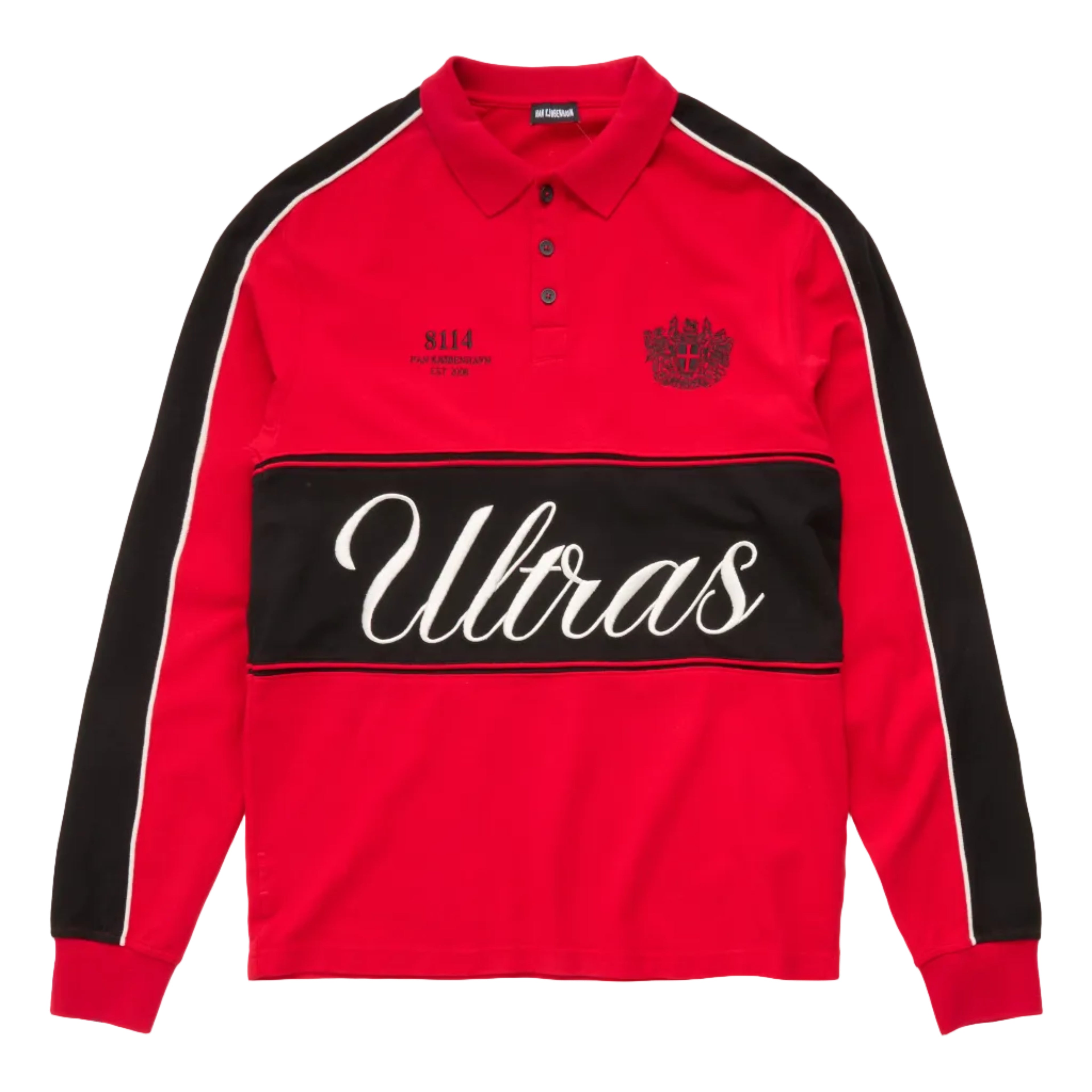 A red long-sleeve polo shirt with black shoulder panels, a black horizontal chest stripe featuring the word 'Ultras' in white script, and small black graphics on the chest, shown on a white background.