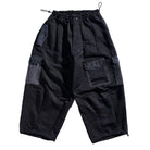 Black cargo pants with multiple pockets on a white background