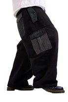 Black cargo pants with multiple pockets on a white background