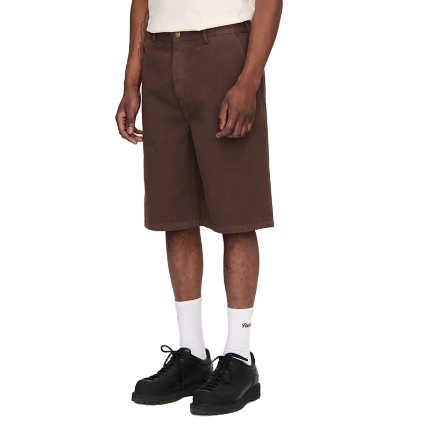 Man wearing a white t-shirt and brown shorts on a plain background