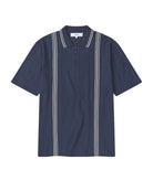 Navy blue polo shirt with white trim on a white background