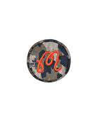 Camouflage driver cover top with orange 'M' on a white background