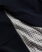 Close-up of dark fabric with a checkered pattern