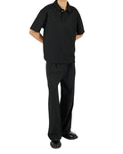 Person wearing a black outfit on a white background